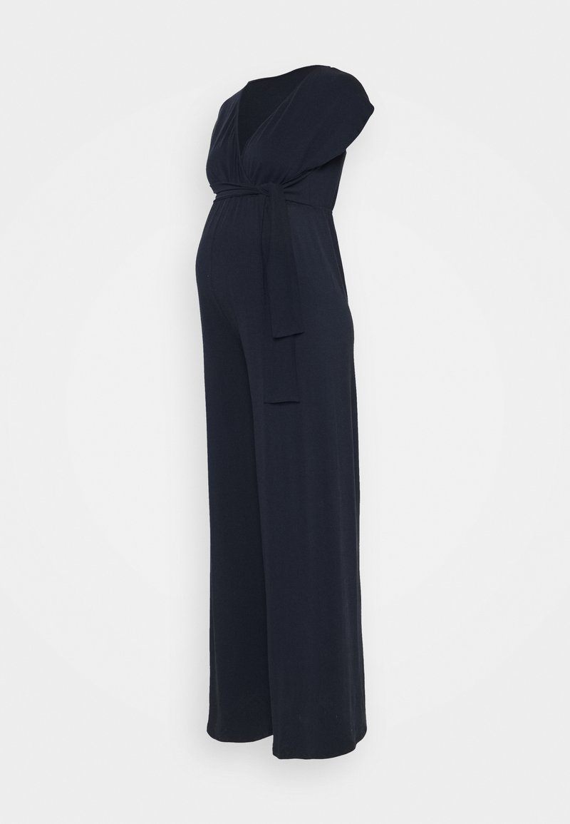 Navy blue maternity jumpsuit with a plunging V-neck, short sleeves, a tied waist detail, and wide-leg design in soft fabric.