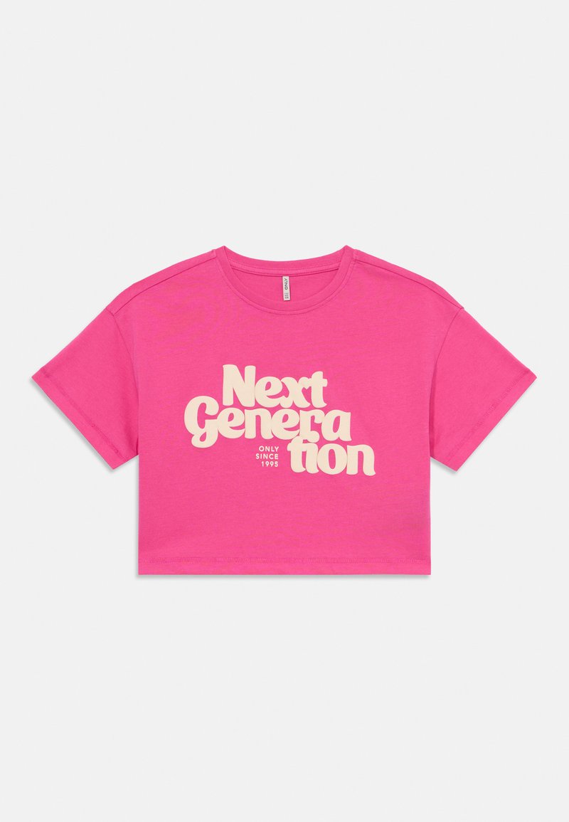 Pink cropped t-shirt made of cotton, featuring large cream text "Next Generation" with "ONLY SINCE 1995" beneath. Short sleeves, round neck.