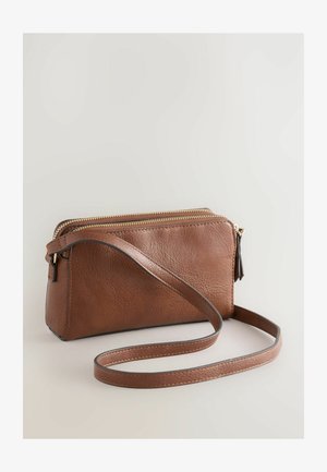 Brown leather crossbody bag featuring a textured finish, gold zipper, and a detachable strap. Compact rectangular shape with subtle stitching.
