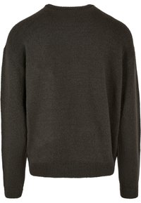 Maglione grigio scuro con lavorazione a maglia testurizzata, scollatura rotonda e spalle scese. Dettagli a coste sui polsini e sull'orlo. Tessuto morbido e di peso medio.