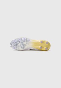 Football shoe outsole with a translucent yellow section, purple studs, and a patterned design featuring black and white accents.
