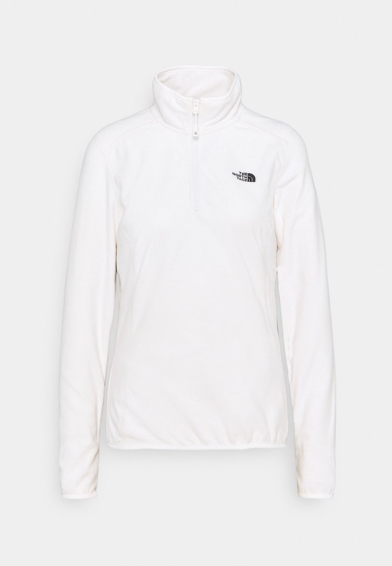 Pull polaire blanc à manches longues avec un quart de fermeture éclair et le logo The North Face sur la poitrine gauche.
