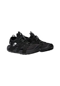 Black athletic shoes with a mesh upper, adjustable straps, and a rugged sole. Pull tabs at the heel and tongue for easy wear.