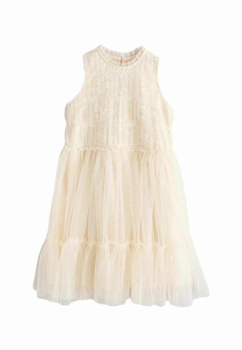 Robe sans manches de couleur crème avec des détails en dentelle sur le corsage et une jupe en tulle transparent à volants superposés avec un ourlet volanté.