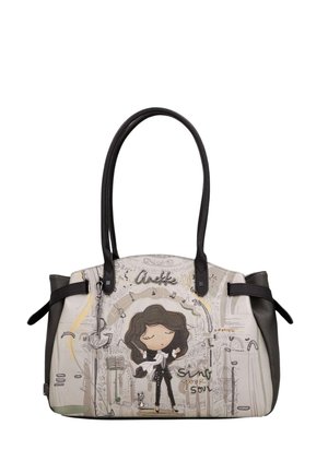 Borsa in pelle con manici neri, raffigurante una donna in stile cartone animato con capelli scuri, note musicali e il testo "Anekke sing your soul."