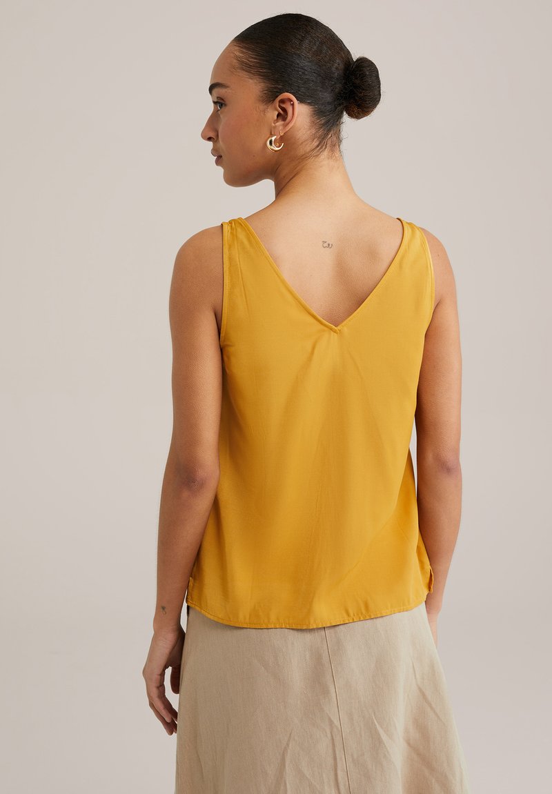 Camicetta Molto Camicetta Scollata Senza Maniche Acquista