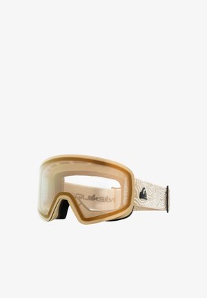Sněžné brýle se zlatým nádechem, velkým zakřiveným sklem, béžovým vzorovaným popruhem a černými akcenty pro bezpečné uchycení. Lehká konstrukce.
