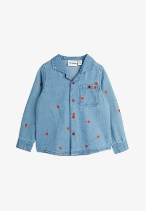 Light blue denim shirt with long sleeves, red heart patterns, and matching red buttons. Features a notch collar and a breast pocket.