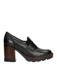Scarpa nera in pelle con tacco alto, punta quadrata, cinturino imbottito e tacco in legno testurizzato. La suola presenta un battistrada prominente per una buona presa.