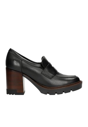 Black leather high-heeled shoe with a square toe, padded strap, and textured wooden block heel. Sole features prominent tread for grip.