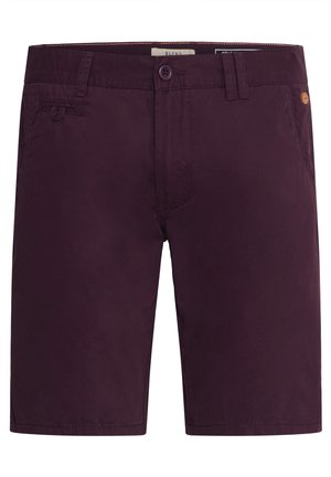 Mørkelilla shorts lavet af blødt stof. Har knaplukning, bæltestropper og sidelommer. Enkel design med minimal detaljering.