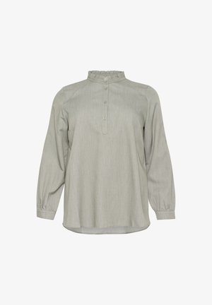 Šviesiai pilkas ilgomis rankovėmis bluzonas su volangų apykakle, mygtukų užsegimu ir susiraukšlėjusiomis rankovėmis. Minkšta, tekstūruota medžiaga, laisvas siluetas, tiesus apvadas.