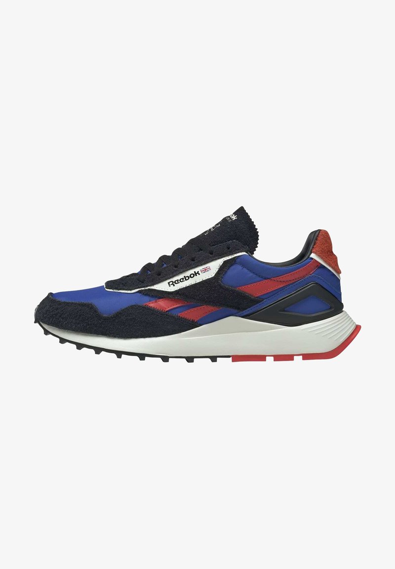 Reebok sneakers featuring a blue nylon upper with black suede accents, red stripes, a white midsole, and a textured rubber outsole.