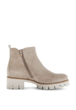 Beiger Wildleder-Schnürstiefel mit seitlichem Reißverschluss, grober heller Sohle und niedrigem Blockabsatz, entwickelt für den Freizeit- oder Außeneinsatz.