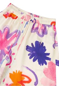 Elastisk talje floral bukser i creme, med store pink, lilla og orange abstrakte mønstre, let stof og en afslappet pasform.