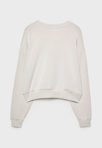 Jasnobeżowy sk cropped sweatshirt wykonany z miękkiego materiału. Posiada szeroki dekolt, opadające ramiona i ściągacze na rękawach. Prosty i nieskomplikowany design.