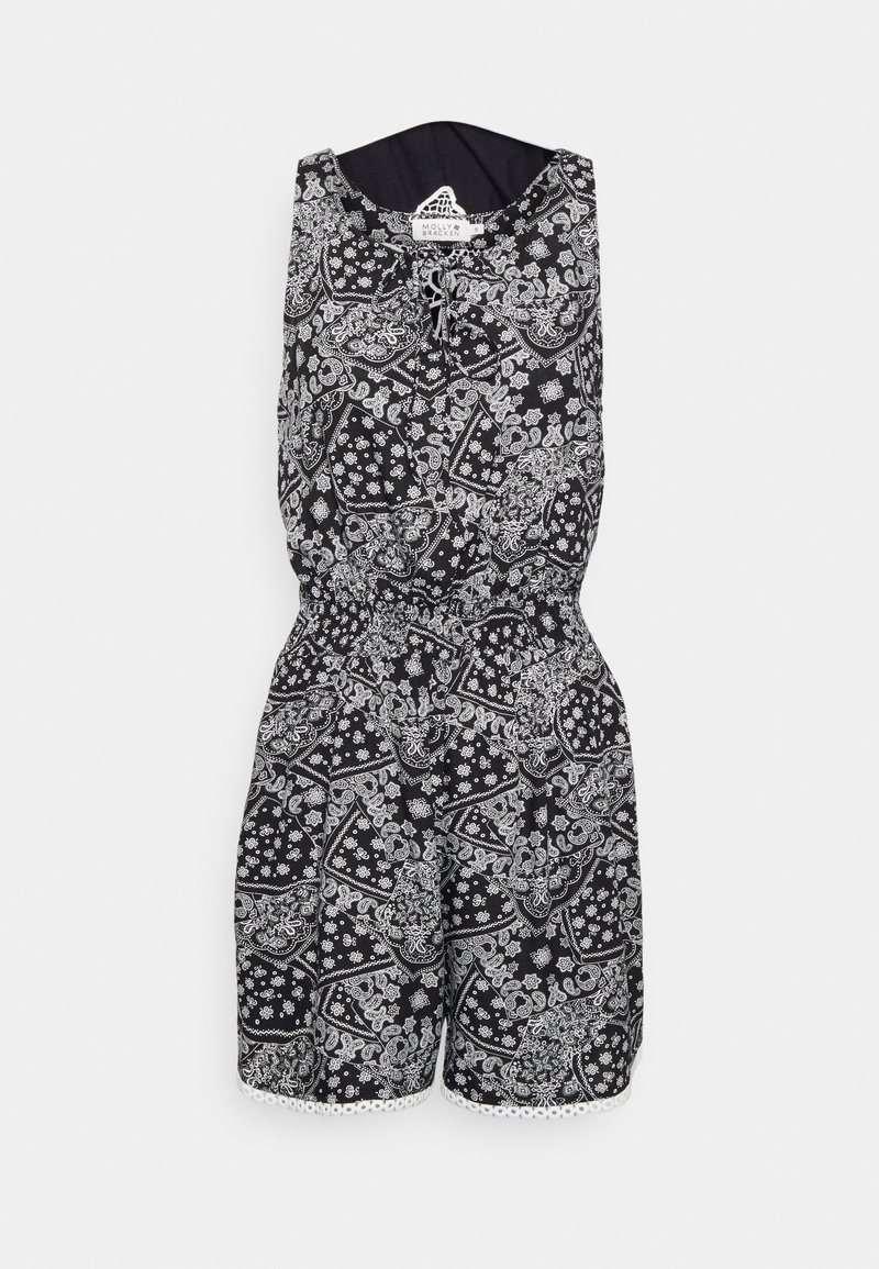 Černobílý overal s květinovým a paisley vzorem, s elastickým pasem a krajkovým lemem. Krátká délka, bez rukávů.