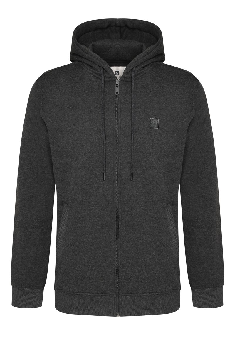 Sudadera con cremallera en un gris oscuro, con capucha ajustable, puños de canalé y dos bolsillos laterales. Presenta un pequeño logo en el pecho. Textura de tela suave.