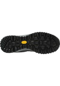 Sort Vibram ydersål med dybt mønster, fremhævet af hævede knopper for godt greb. Forstærkede kanter og centralt gult logo som accent.