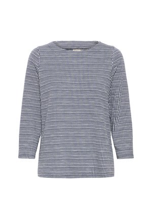 Chemise pour femme à manches longues, à motif carreaux bleu marine et blanc, avec un col rond et une coupe décontractée.