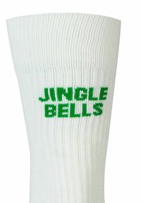 Calzino bianco a costine con testo verde "JINGLE BELLS". Materiale in cotone misto, lunghezza a metà polpaccio, texture liscia e bordo elastico.