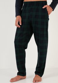 Sorte bomulds plaid pyjamabukser i mørkegrøn og marineblå, med elastisk talje og lommer, i en afslappet pasform og glat tekstur.