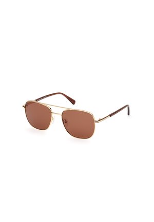 Lunettes de soleil teintées marron avec une monture en métal doré, des verres ronds et des branches en plastique marron. Présente un logo discret sur un des verres.