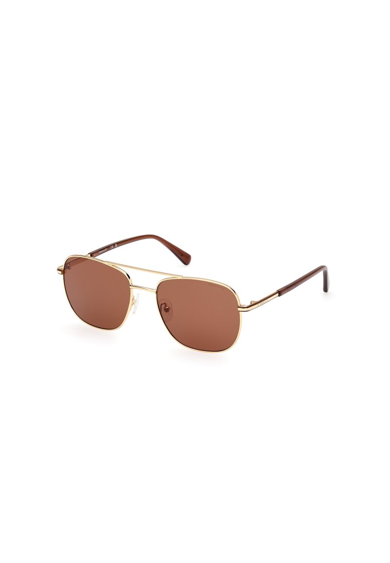 Bruin getinte zonnebril met een gouden metalen frame, ronde lenzen en bruine plastic pootjes. Voorzien van een subtiel logo op één lens.