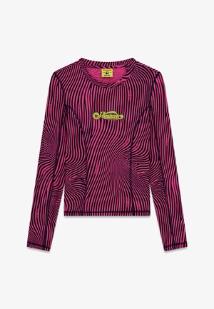 Long-sleeve pink top with black wavy stripes, yellow-green "Hysteric Guess Jeans" logo at center chest, and visible black stitching details.