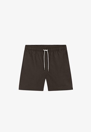 Zwarte zwemshorts voor mannen met elastische tailleband en wit trekkoord, ontworpen voor casual gebruik of op het strand.