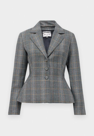 Halluxplaid bleiser hallituskaeluse, kahe nupuga ja peplum taljega. Omab mustris siniseid, oranže ja valgeid jooni.