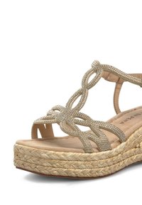 Gold-tone espadrille sandal featuring braided straps adorned with rhinestones and a woven jute platform sole. Soft beige footbed.