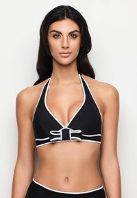 Svart halterneck bikiniöversdel med djup urringning, vit trim och en rosett i mitten. Slät tyg med tonalt kontrast.