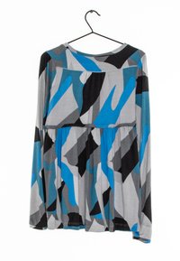 Long-sleeved garment in gray fabric featuring an abstract pattern of black, blue, and light gray shapes, with a gathered waist detail.