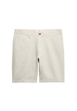 Jasnobeżowe krótkie spodenki wykonane z teksturowanej tkaniny. Posiadają zapięcie na guzik, dwie przednie kieszenie oraz subtelne detale przeszyć.