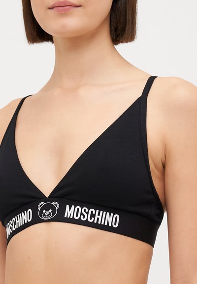 Black cotton triangle bralette with thin straps and a contrasting white band featuring a bear logo and "Moschino" text.