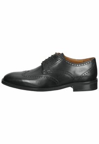 Scarpe da uomo in pelle nera con design a wingtip, dettagli perforati, cinque occhielli e finitura liscia. Tacco leggermente rialzato e suola in gomma.