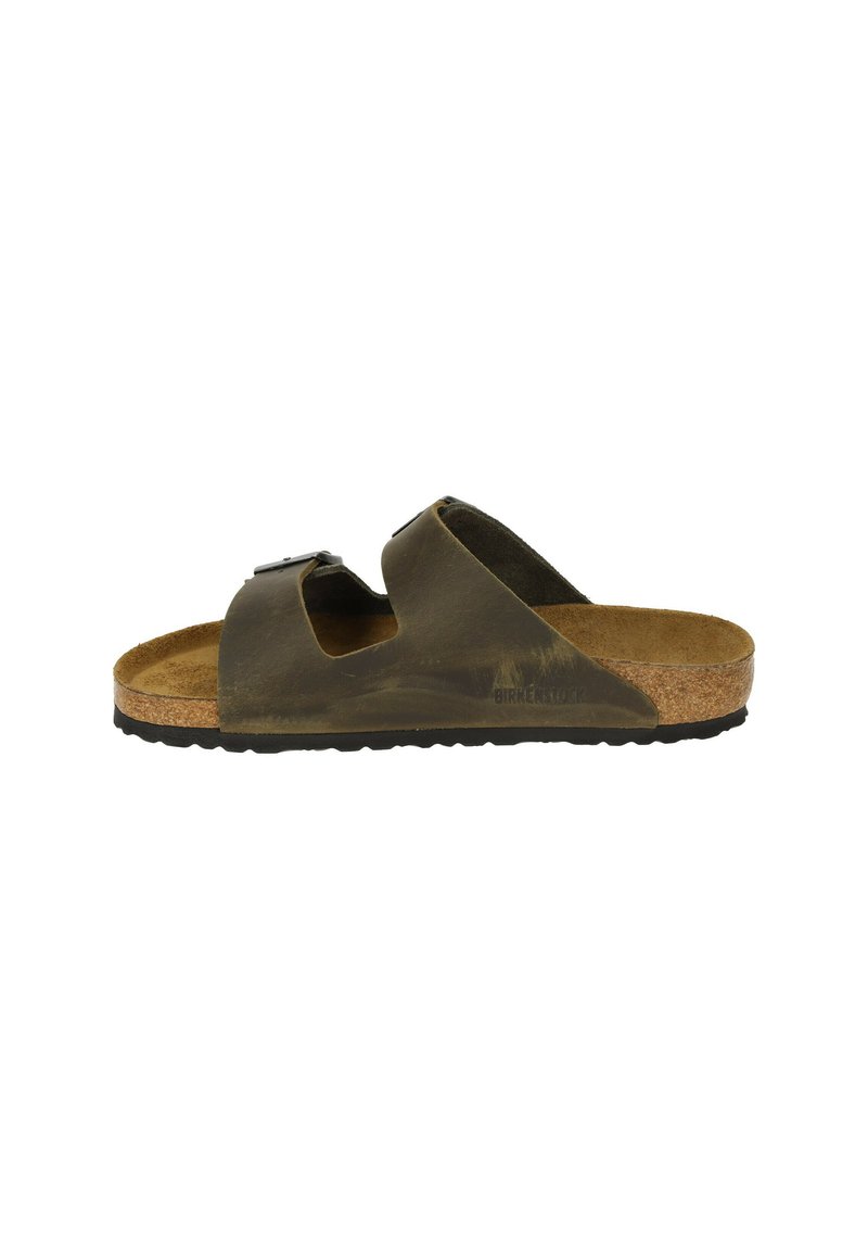Sandalo con sottofondo in sughero marrone, dotato di due cinturini regolabili, una superficie testurizzata e una suola in gomma nera. Presenta un design minimalista.