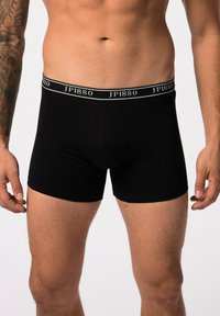 Boxer shorts en coton noir avec une coupe ajustée, dotés d'une large ceinture élastique avec le logo "JP1880" en lettres blanches.