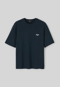 T-shirt en coton bleu marine avec un col rond et des manches courtes. Présente un petit logo blanc "Buddies" sur la poitrine gauche.