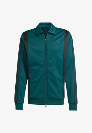 Türkisfarbene Trainingsjacke mit schwarzen Streifen, Reißverschluss und Kragen. Verfügt über Seitentaschen und ein Logo auf der Brust. Hergestellt aus glattem Stoff.