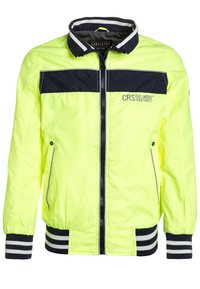 Neon gul jacka med en svart panel över bröstet, dragkedjeslutning, ribbade marinblå ärmslut och vita ränder i nederkant för kontrast.