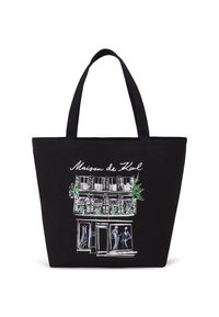 Sac en toile noir avec un design illustré de vitrine, des accents verts, des fenêtres et des silhouettes en robes bleues.
