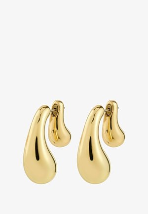 Kolczyki w odcieniu złota o organicznym kształcie łzy, z gładką, refleksyjną powierzchnią i bezpiecznym zapięciem na sztyft.