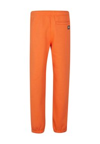 Orange Sweatpants mit elastischem Bund und Bündchen. Enthält eine Gesäßtasche mit eckigem Etikett. Hergestellt aus einem weichen Stoff.