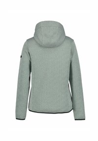 Giacca con cappuccio in un motivo geometrico verde e bianco, con maniche lunghe e un bordo nero lungo l'orlo e i polsini.
