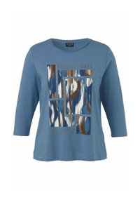 Blaues Langarm-T-Shirt mit einem grafischen Aufdruck in Creme, Braun und dunklerem Blau, mit dem Text "BRIGHT DAYS" und einer glatten Textur.