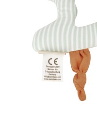 Striped green and white soft fabric with a knotted orange texture accent. Includes a tag with CE certification and brand details.