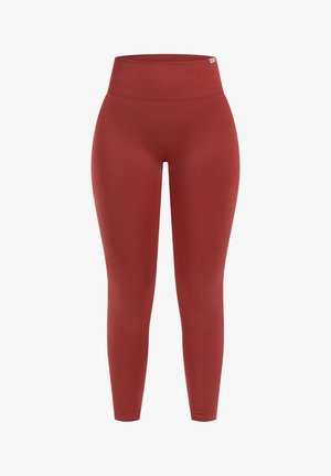 Leggings rossi a vita alta realizzati in tessuto elastico, con una texture liscia e una forma aderente, senza cuciture o motivi visibili.