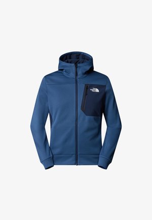 Blauwe zip-up hoodie van zachte stof, met een capuchon, een ritssluitingzak op de linkerkant van de borst en contrasterende donkerblauwe accenten.